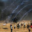 Palestinians protest as Israeli forces fire tear gas near the Israeli fence east of Gaza City on September 21, 2018