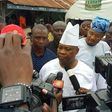 Dancing Senator Ademola Adeleke talking to newsmen after casting his vote
