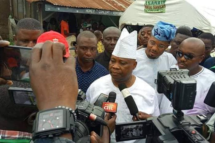 Dancing Senator Ademola Adeleke talking to newsmen after casting his vote