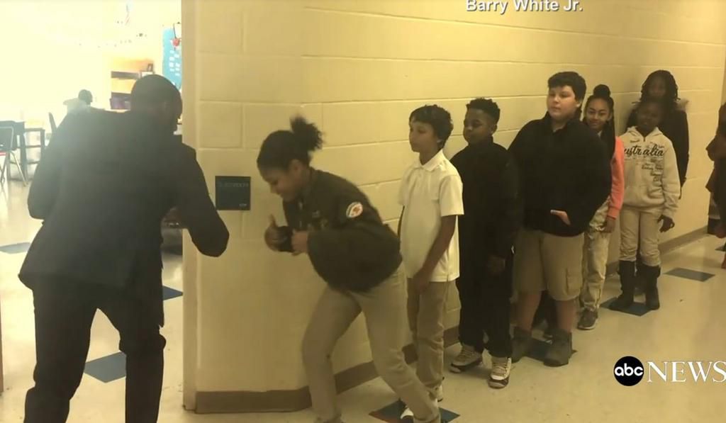 Barry White greeting a student