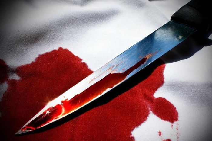 Knife stained with blood.