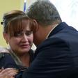 Ukrainian President Petro Poroshenko hugs a relative of one of the sailors arrested captured by Russia in one of the most dangerous incident between the two ex-Soviet neighbours in years