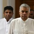 Sri Lanka's ousted premier Ranil Wickremesinghe (C) has refused to vacate the prime minister's official residence since his dismissal in October