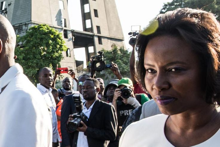President Jovenel Moises, with his wife Martine tienne Joseph, leaves a ceremony marking the the assassination of Jean-Jacques Dessalines, leader of the Haitian Revolution and the first ruler of an independent Haiti, Port-au-Prince on October 17, 2019....