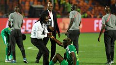 Senegal coach Aliou Cisse consoles defender Salif Sane after defeat in the final