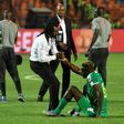 Senegal coach Aliou Cisse consoles defender Salif Sane after defeat in the final