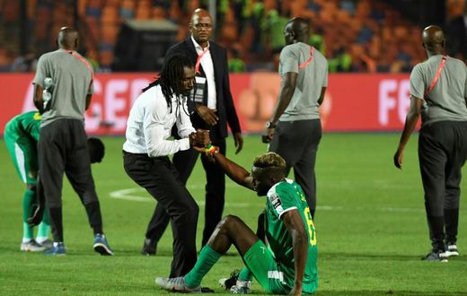 Senegal coach Aliou Cisse consoles defender Salif Sane after defeat in the final