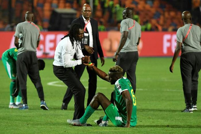 Senegal coach Aliou Cisse consoles defender Salif Sane after defeat in the final