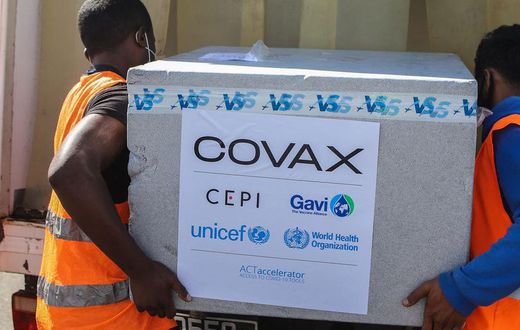 Workers load boxes of COVID-19 vaccines for COVAX in Antananarivo, Madagascar.