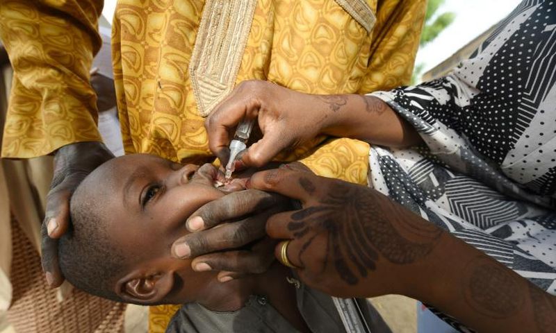 Vaccination programmes like this one in Nigeria in 2017 eradicated wild poliovirus in Africa but vaccine-derived polio still poses a threat in many countries