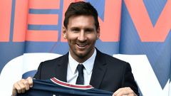 Welcome to Paris: Lionel Messi poses as he holds-up his number 30 shirt