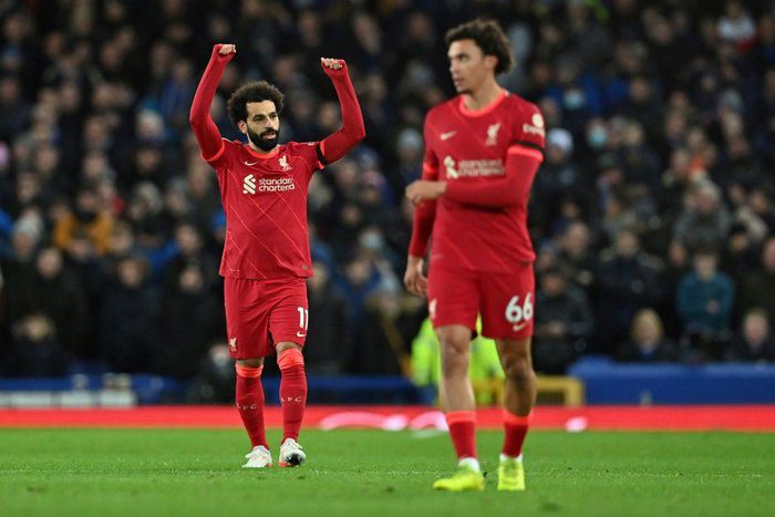 Derby delight: Mohamed Salah (left)scored twice as Liverpool beat Everton