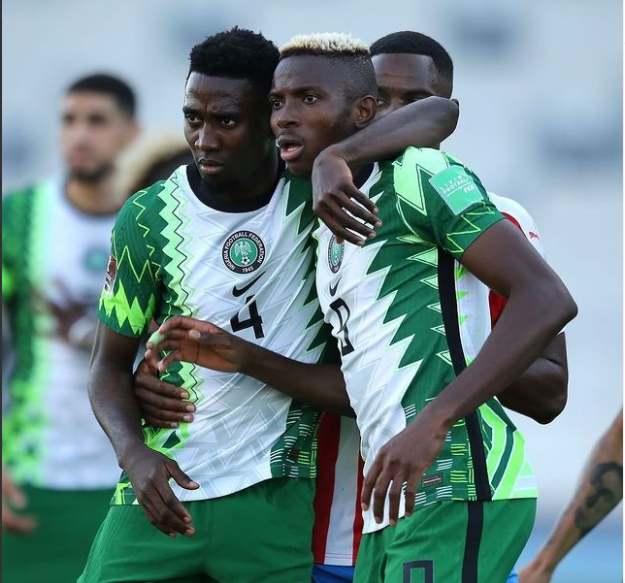 Victor Osimhen celebrates his opener with Wilfred Ndidi in Tangier, Morocco.