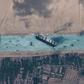 Tugboats work to help free the Even Given ship from the Suez Canal just before noon local time on Monday, March 29, 2021.