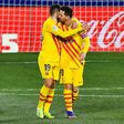 Lionel Messi and Jordi Alba celebrate Barca's opening goal against Huesca