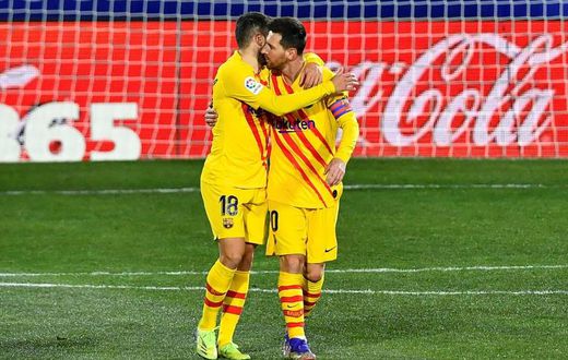 Lionel Messi and Jordi Alba celebrate Barca's opening goal against Huesca