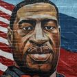 A mural painted by artist Kenny Altidor depicting George Floyd is unveiled on a sidewall of CTown Supermarket on July 13, 2020 in the Brooklyn borough New York City.