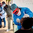 Doctors Without Borders nurse Bhelekazi Mdlalose performs a COVID-19 test on a health worker at the Vlakfontein Clinic in Johannesburg, South Africa, on May 13, 2020.