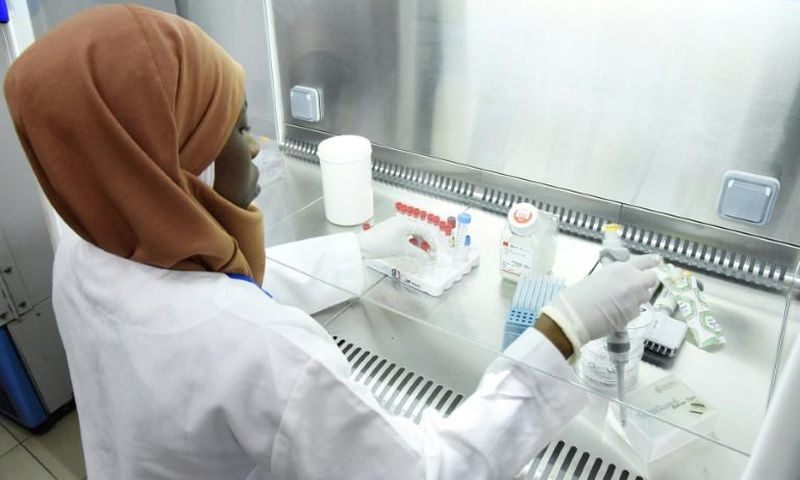 A scientist researches the new coronavirus at the Pasteur Institute in Dakar in February 2020