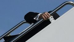 President Joe Biden trips while boarding Air Force One at Joint Base Andrews in Maryland on March 19, 2021.