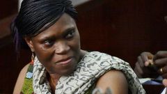 Former Ivorian first lady Simone Gbagbo looks on at Abidjan's courthouse on October 10, 2016 before the re-opening of her trial