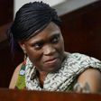 Former Ivorian first lady Simone Gbagbo looks on at Abidjan's courthouse on October 10, 2016 before the re-opening of her trial