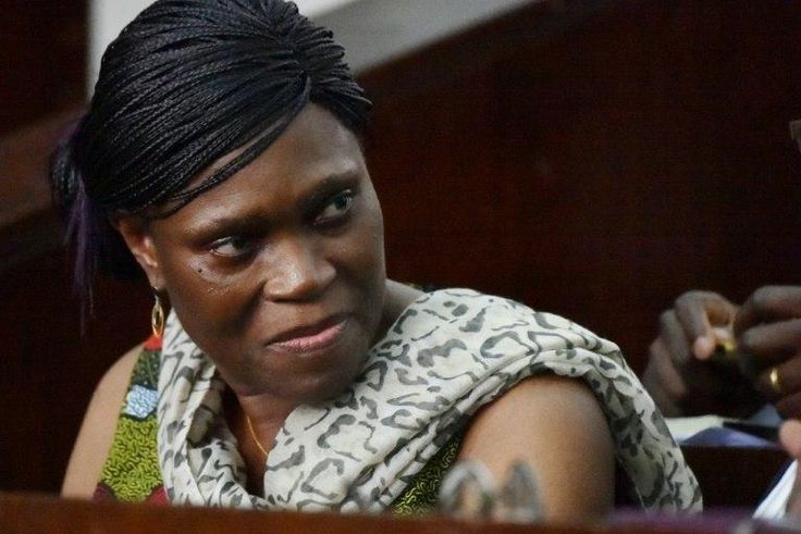 Former Ivorian first lady Simone Gbagbo looks on at Abidjan's courthouse on October 10, 2016 before the re-opening of her trial