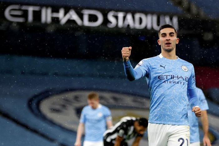 On the rise: Ferran Torres (right) scored Manchester City's second as they moved up to fifth in the Premier League
