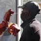 Health worker Vuyiseka Mathambo takes a nasal swab from a patient to test for COVID-19 at a Masiphumelele community centre in Cape Town, South Africa on July 23, 2020.