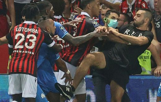 The trouble started when Marseille's Dimitri Payet (2nd L) reacted to being pelted with bottles by the Nice supporters