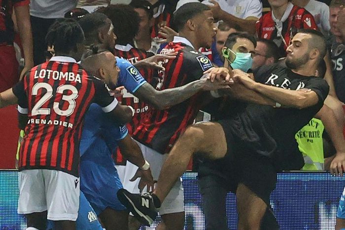 The trouble started when Marseille's Dimitri Payet (2nd L) reacted to being pelted with bottles by the Nice supporters