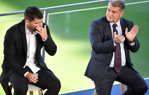 A tearful Sergio Aguero (L) with Barcelona president Joan Laporta at a press conference at the Camp Nou to announce his retirement from football on Wednesday