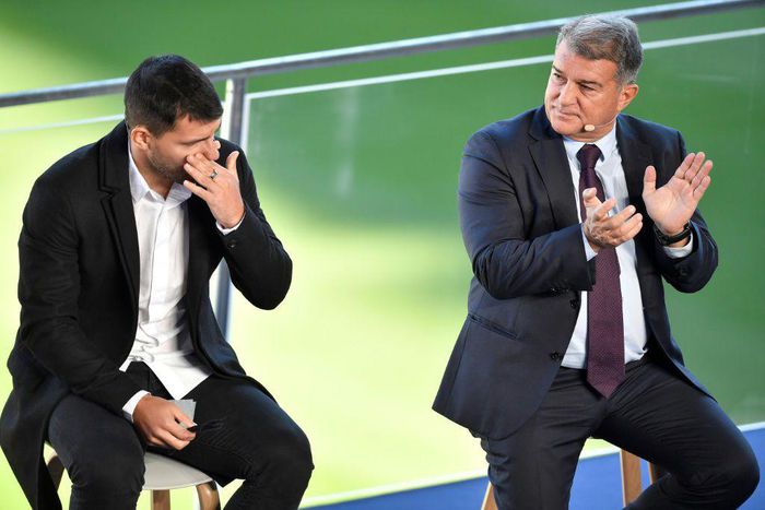 A tearful Sergio Aguero (L) with Barcelona president Joan Laporta at a press conference at the Camp Nou to announce his retirement from football on Wednesday