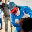 Doctors Without Borders nurse Bhelekazi Mdlalose performs a COVID-19 test on a health worker at the Vlakfontein Clinic in Johannesburg, South Africa on May 13, 2020.