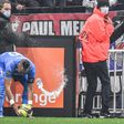 Marseille's French midfielder Dimitri Payet (left) was hit by a bottle of water thrown from the stands during the Ligue 1 match against Lyon