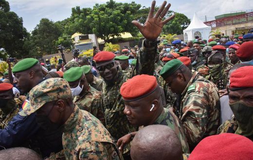 Coup leader Mamady Doumbouya (Hand raised)