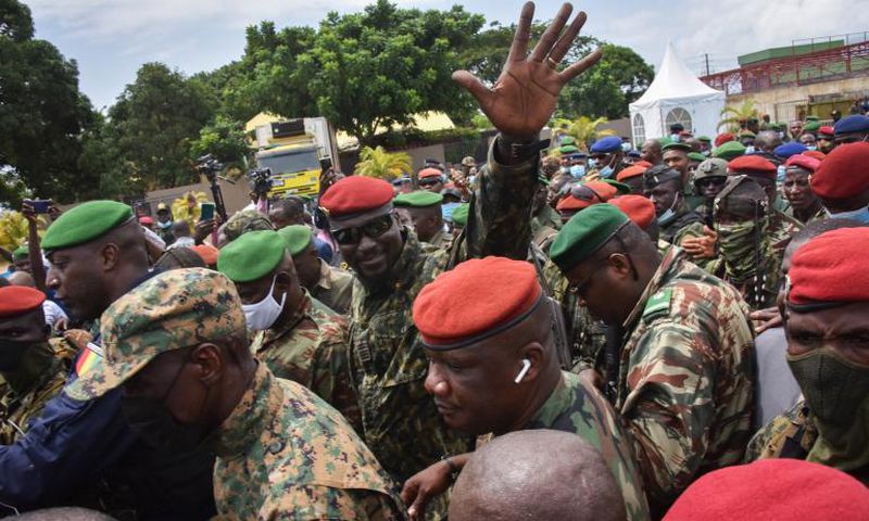 Coup leader Mamady Doumbouya (Hand raised)