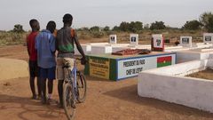 Boys stand next to the grave of former president Thomas Sankara in Ouagadougou, Burkina Faso, November 25, 2014. REUTERS/Joe Penney