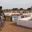 Boys stand next to the grave of former president Thomas Sankara in Ouagadougou, Burkina Faso, November 25, 2014. REUTERS/Joe Penney