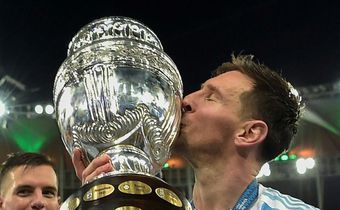 Argentina's Lionel Messi kisses the trophy after winning the Copa America for the first time following a 1-0 win over Brazil