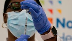 Dr. Michelle Chester draws the Covid-19 vaccine into a syringe at Long Island Jewish Medical Center, on December 14, 2020 in the Queens borough of New York.