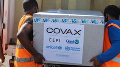 Workers load boxes of COVID-19 vaccines for COVAX in Antananarivo, Madagascar.