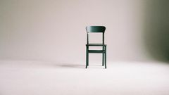 green-wooden-chair-on-white-surface-963486