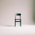green-wooden-chair-on-white-surface-963486