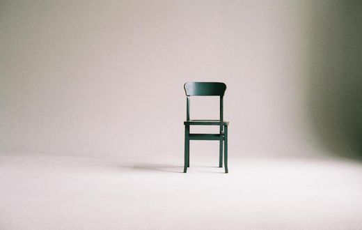 green-wooden-chair-on-white-surface-963486