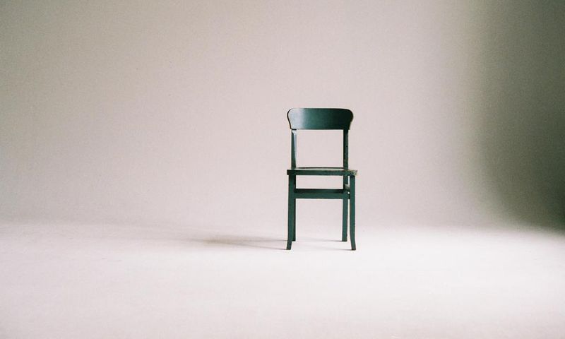 green-wooden-chair-on-white-surface-963486