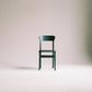 green-wooden-chair-on-white-surface-963486