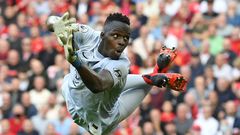 Senegal goalkeeper Edouard Mendy dives while playing for Chelsea against Liverpool in the English Premier League at the weekend