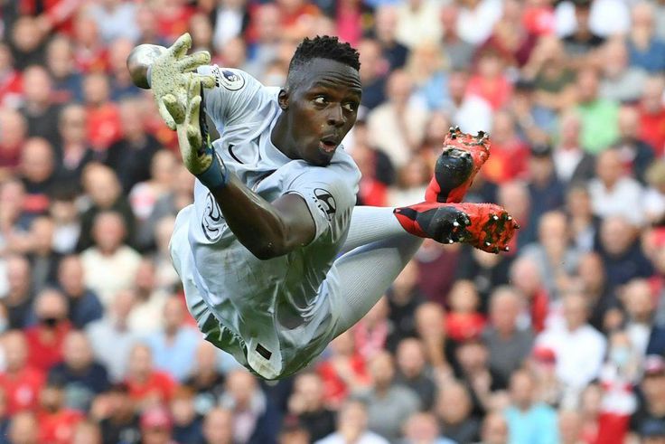 Senegal goalkeeper Edouard Mendy dives while playing for Chelsea against Liverpool in the English Premier League at the weekend