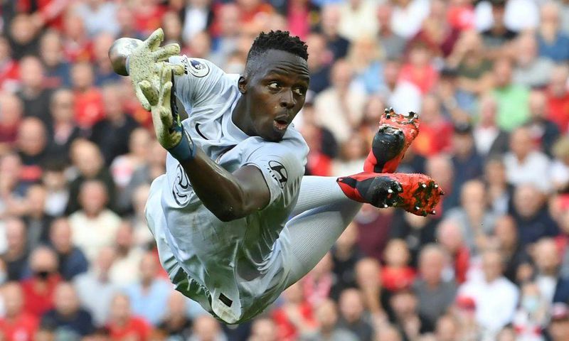 Senegal goalkeeper Edouard Mendy dives while playing for Chelsea against Liverpool in the English Premier League at the weekend